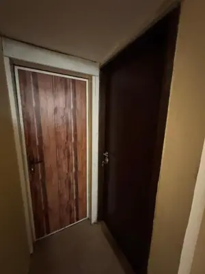 an empty room with a wooden door in a room at Cozy High-Street Loft in Sofia's Best Central Location in Sofia