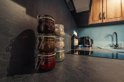 a group of glass jars on a counter in a kitchen at Rila Family Haven in Samokov