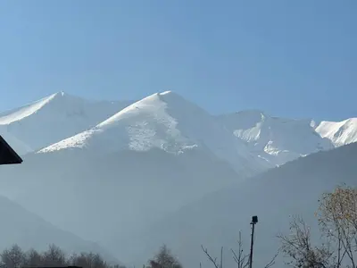 a snow covered mountain in the distance at At Marti in Bansko