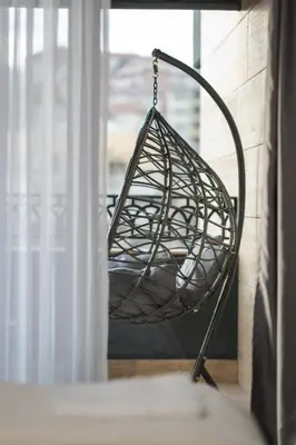 a metal swing in a room with a window at Simaya, your home in the heart of Sandanski in Sandanski