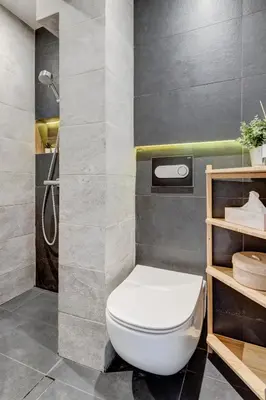 a bathroom with a toilet and a shower at Cozy Bright Space in the Heart of Women's Market in Sofia