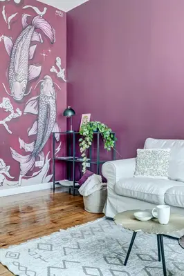 a living room with purple walls and a white couch at Cozy Bright Space in the Heart of Women's Market in Sofia