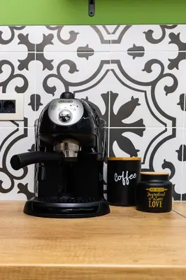 a coffee maker sitting on a counter with two cups at Bright & Cozy Studio in Plovdiv by Flat Mаnager in Plovdiv
