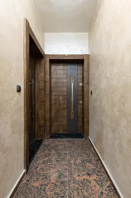 an empty hallway with a door and a carpet at Bright & Cozy Studio in Plovdiv by Flat Mаnager in Plovdiv