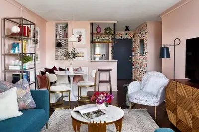 a living room with a blue couch and a table at Luxury Apartment Bansko in Bansko