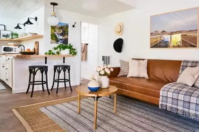 a living room with a couch and a table at Luxury Apartment Bansko in Bansko