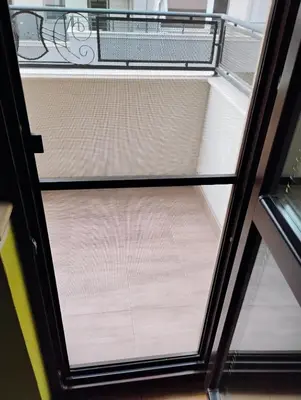 an open door to a room with a window at Апартамент за гости 
