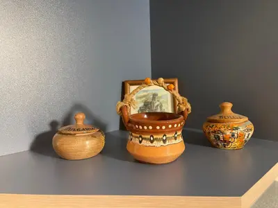 three vases sitting on a shelf with a picture at Art city studio in Sofia center in Sofia