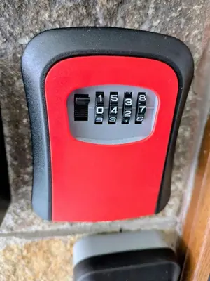 a red remote control sitting on top of a counter at Modern 1 Bedroom by the Gondola in Bansko