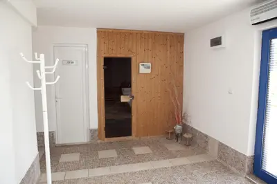 a hallway with a wooden door in a room at Spa Villa Crystal in Hisarya