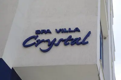 a sign for a spa villa carillon on the side of a building at Spa Villa Crystal in Hisarya