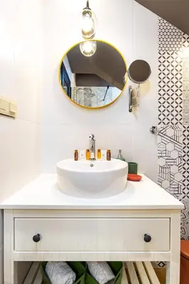 a bathroom with a white sink and a mirror at Kapana Art Sky Studios Parking Included in Plovdiv