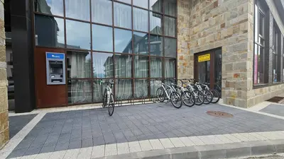 a group of bikes parked in front of a building at AZAX Apartments in Terra Complex in Bansko