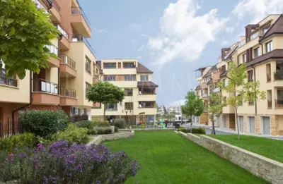 a park in front of some apartment buildings at Cite Jardin in Sofia