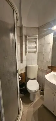 a small bathroom with a toilet and a sink at Home away from home in Sofia