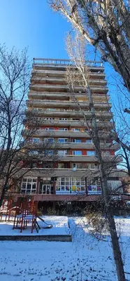 a tall building with snow in front of it at Home away from home in Sofia