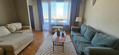 a living room with two couches and a coffee table at Home away from home in Sofia
