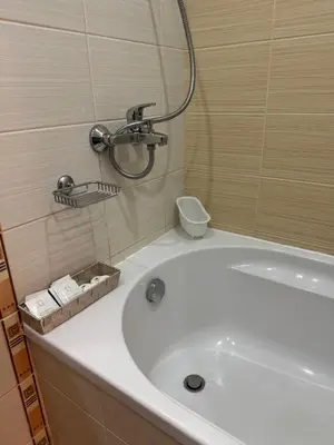 a white tub in a bathroom with a shower at Borovets Gardens MVS Apart D42 in Borovets