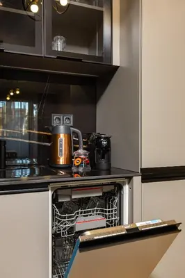 a kitchen with a dishwasher with a tea pot in it at Two-Bedroom Apartments with Free Private Parking and 6min to Center in Plovdiv