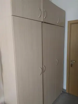 a group of three wooden cabinets in a room at Георгиев Луксури Апарт in Pamporovo