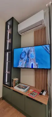 a large flat screen tv on a wall at MariGold Apartments in Sandanski