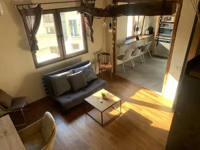 a living room with a couch and a table at Graf's Prestige Duplex in Sofia