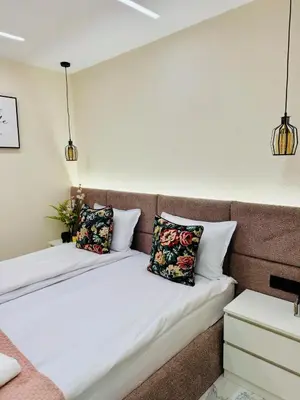 two beds in a room with two pillows at luxuri suite ''dezodava'' in Sandanski