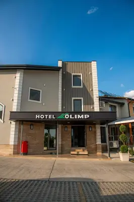 a hotelillian building with a hotelulum sign on it at Семеен Хотел Олимп in Sopot