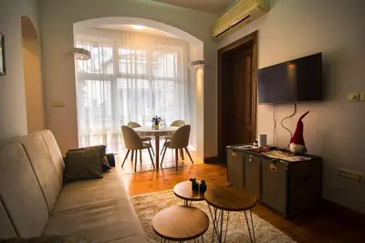 a living room with a santa hat on the wall at Tatyana City garden in Plovdiv