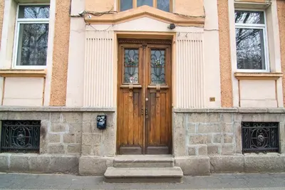 a wooden door on the side of a building at Tatyana City garden in Plovdiv