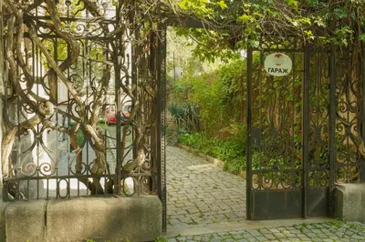 an entrance to a gate with a stone walkway at Tatyana City garden in Plovdiv
