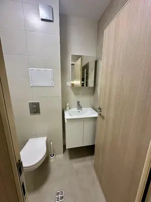 a bathroom with a toilet and a sink at Music Flats in Sofia