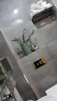 an overhead view of a bathroom with a vase of flowers at S íRMA Apartment - Next to the Old Cathedral in Sofia