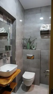 a bathroom with a white toilet and a sink at S íRMA Apartment - Next to the Old Cathedral in Sofia
