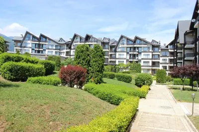 a row of apartment buildings in a park at Apartment for guests in Bansko