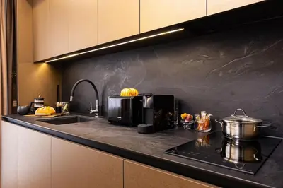 a kitchen counter with a microwave and a sink at Happy People 2 BD, Central Plovdiv by Flat Mаnager in Plovdiv