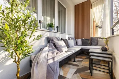 a living room with a couch and a plant at Happy People 2 BD, Central Plovdiv by Flat Mаnager in Plovdiv