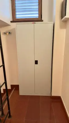 a white cabinet in a room with a window at Daniel's Suite - 4 Season apartment in Bansko