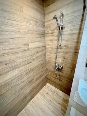 a bathroom with a shower and a sink at просторен и уютен двустаен в Долен Лозенец - кварталът на артистите in Sofia