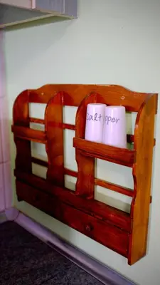 a wooden shelf in a wall with two paper at просторен и уютен двустаен в Долен Лозенец - кварталът на артистите in Sofia