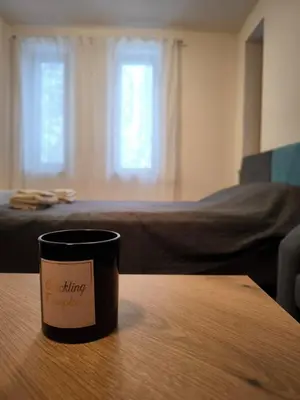 a coffee cup sitting on top of a wooden table at NiSimo Apartment Grand Resort Pamporovo in Pamporovo