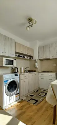 a kitchen with a washing machine and a sink at Апартамент Калоян in Banya