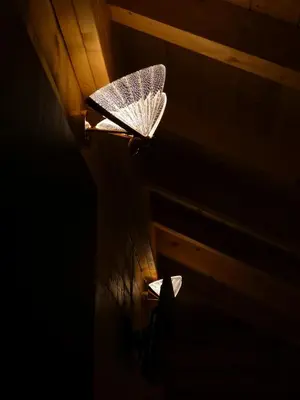 a ceiling light in a dark room at Стилни и Луксозни Вили за разпускане in Malo Buchino
