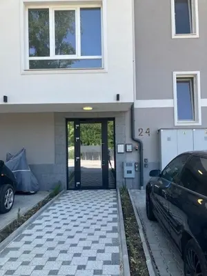 a car parked in front of a building with a door at Ira 28 in Sandanski