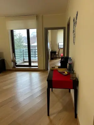 a room with a table with a red cloth on it at Beauty&Travel Apartment Borovets in Borovets