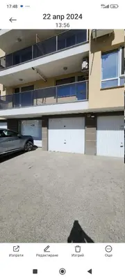 a parking lot in front of a building at Zen Lodge, with private parking next to Paradise in Sofia