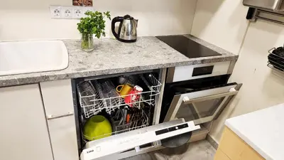 a dishwasher in a kitchen next to a sink at Zen Lodge, with private parking next to Paradise in Sofia
