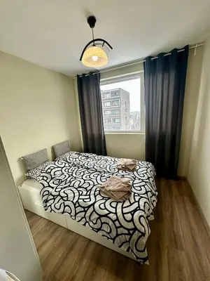 a bedroom with a bed in a room with a window at Maria Luiza 1 Bedroom Apartment in Sofia