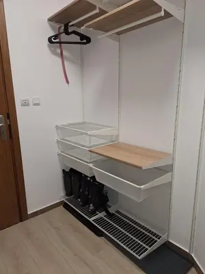 a closet with empty shelves in a room at Rila Park ap by the Slopes in Borovets