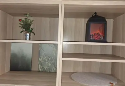 a wooden shelf with a fireplace in a room at Rila Park ap by the Slopes in Borovets